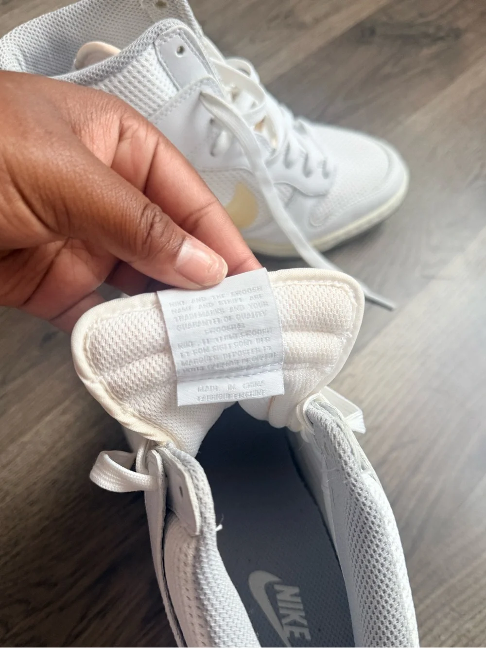 Nike White High-Top Sneakers with Pale Yellow Swoosh